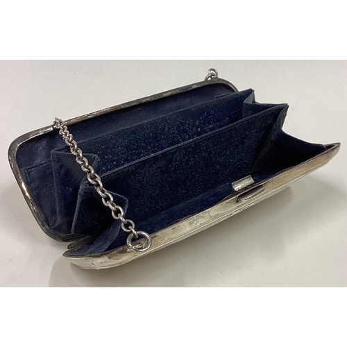 95 - A good quality engine turned silver purse on suspension chain. Approx. 83 grams. Est. £40 - £60.