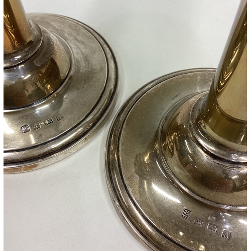 98 - A pair of circular silver candlesticks. Birmingham. Approx. 675 grams of gross weight. Est. £50 - £8... 