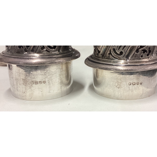 350 - A large pair of Victorian silver sugar casters. London 1888. By Thomas Bradbury & Sons. Approx. 569 ... 