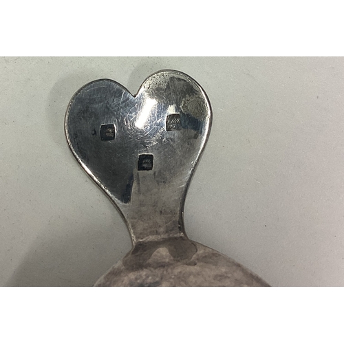 69 - A heart shaped silver caddy spoon. Approx. 10 grams. Est. £30 - £40.