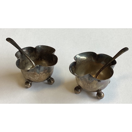 686 - A pair of silver salts on ball feet. London. By Henry Wilkinson & Co Ltd. Together with two silver s... 