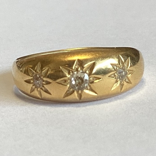 708 - A good diamond three stone gypsy set ring in 18 carat gold mount. Approx. 4 grams. Est. £150 - £200.