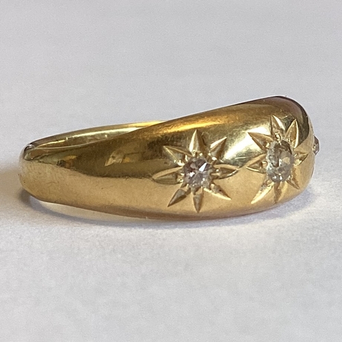 708 - A good diamond three stone gypsy set ring in 18 carat gold mount. Approx. 4 grams. Est. £150 - £200.