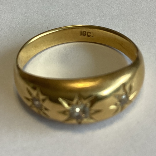 708 - A good diamond three stone gypsy set ring in 18 carat gold mount. Approx. 4 grams. Est. £150 - £200.