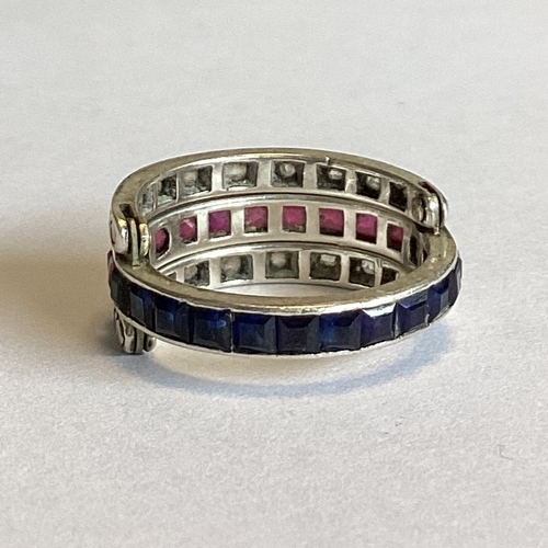 704 - A sapphire, ruby and diamond hinged 'night and day' ring set in platinum. Approx. 4 grams. Est. £250... 