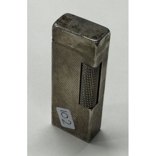 102 - A Dunhill lighter. Approx. 72 grams. Est. £20 - £30.