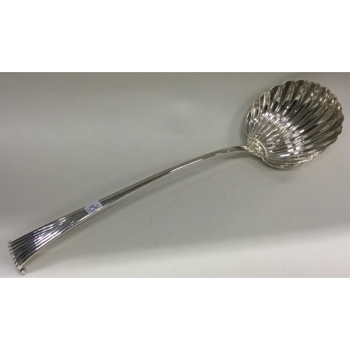 106 - A large 18th Century silver Onslow pattern soup ladle of fluted design. Circa 1790. Approx. 162 gram... 