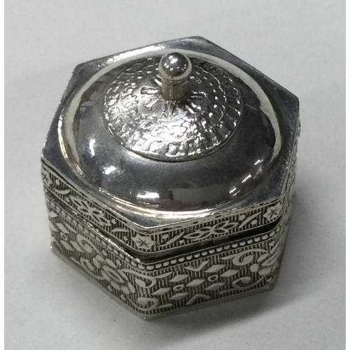 109 - An Antique 19th Century engraved silver pill box with lift-off cover. Marked to base. Approx. 27 gra... 