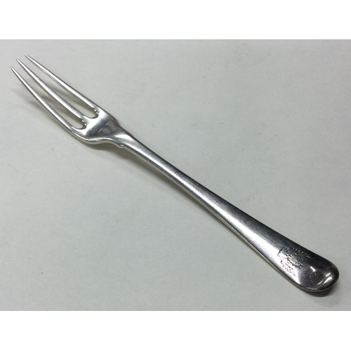 112 - An 18th Century silver three prong fork. Marked to base. Approx. 36 grams. Est. £80 - £120.