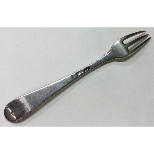 112 - An 18th Century silver three prong fork. Marked to base. Approx. 36 grams. Est. £80 - £120.