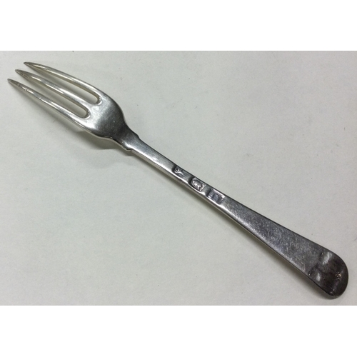 114 - An 18th Century silver three prong fork. Marked to base. Approx. 37 grams. Est. £80 - £120.