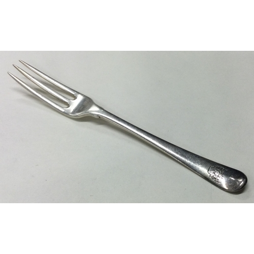 116 - An 18th Century silver three prong fork. Marked to base. Approx. 38 grams. Est. £80 - £120.