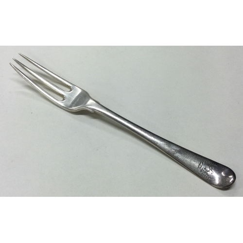 117 - An 18th Century silver three prong fork. Marked to base. Approx. 39 grams. Est. £80 - £120.