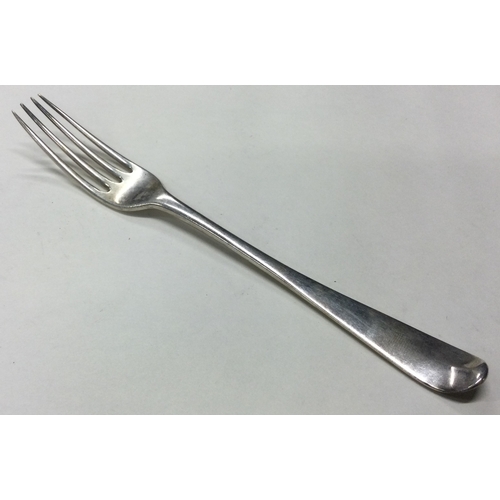 118 - An 18th Century silver four prong fork. Marked to base. Approx. 64 grams. Est. £80 - £120.