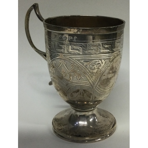 14 - An engraved Victorian silver mug. Birmingham 1872. By John Linegar. Approx. 106 grams. Est. £100 - £... 