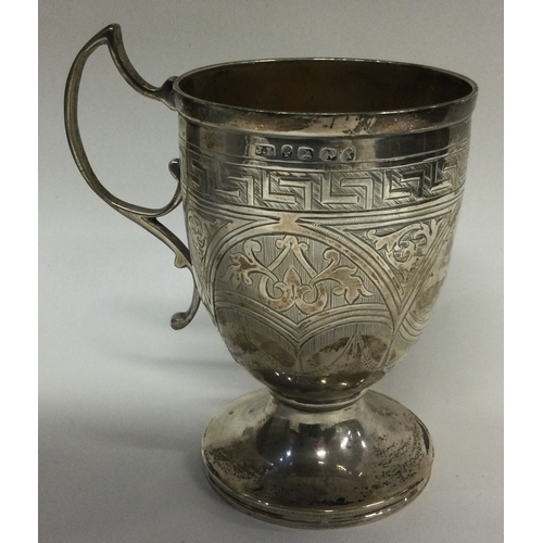 14 - An engraved Victorian silver mug. Birmingham 1872. By John Linegar. Approx. 106 grams. Est. £100 - £... 