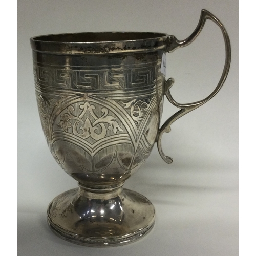 14 - An engraved Victorian silver mug. Birmingham 1872. By John Linegar. Approx. 106 grams. Est. £100 - £... 