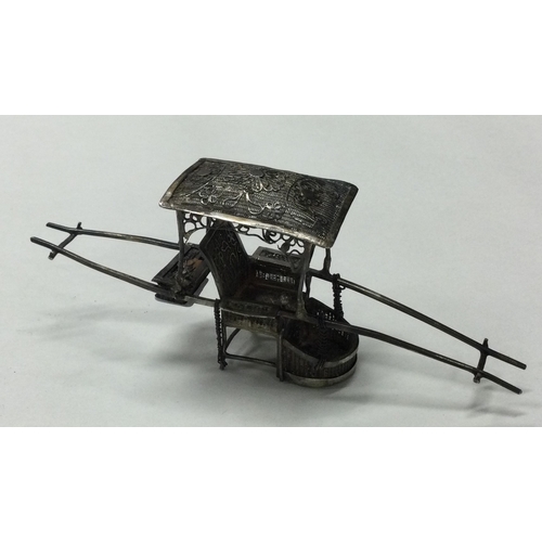 140 - A 19th Century Chinese silver model of a wheelbarrow. Signed verso. Approx. 19 grams. Est. £30 - £50... 