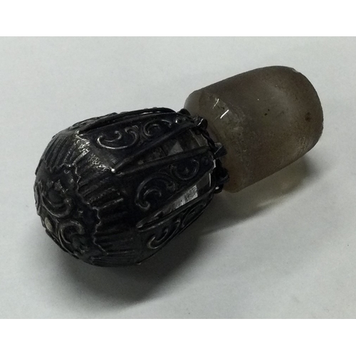 145 - A silver bottle stopper of pierced form. Est. £10 - £20.