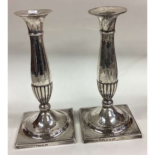 151 - A good pair of 18th Century George III candlesticks on square bases. Sheffield 1793. Approx. 883 gra... 