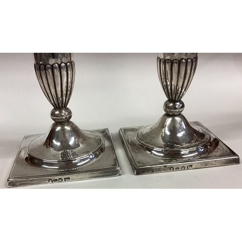 151 - A good pair of 18th Century George III candlesticks on square bases. Sheffield 1793. Approx. 883 gra... 