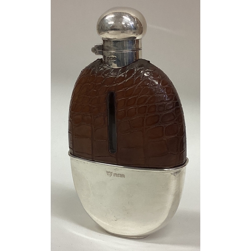 153 - A large Victorian silver mounted glass and leather flask with screw-top lid. Sheffield 1900. Approx.... 