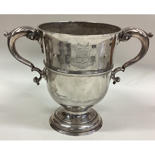 157 - A large 18th Century Provincial silver two-handled cup with central armorial. Maker's mark only. App... 