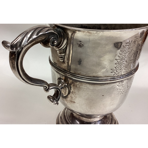 157 - A large 18th Century Provincial silver two-handled cup with central armorial. Maker's mark only. App... 