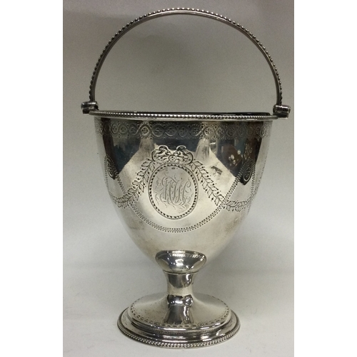 16 - A good 18th Century George III silver swing handled basket with BGL. London 1779. By Benjamin Davenp... 