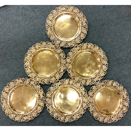 162 - A set of six pierced silver gilt plates with grape and vine decoration. Birmingham 1907. By Elkingto... 