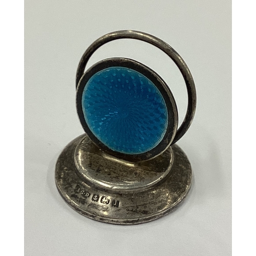 184 - A silver and blue enamelled menu holder. Birmingham 1910. Approx. 23 grams. Est. £100 - £150.