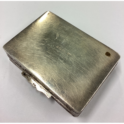 186 - A chased silver box bearing import marks. Approx. 15 grams. Est. £30 - £50.