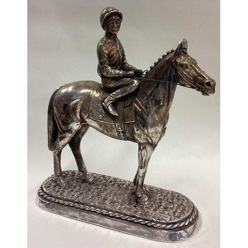 194 - A large silver figure of a jockey on horse, inscribed 'Sheldon'. 1987. Approx. 1133 grams of gross w... 