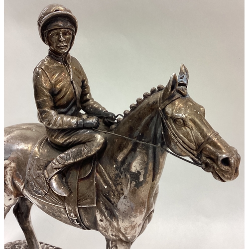 194 - A large silver figure of a jockey on horse, inscribed 'Sheldon'. 1987. Approx. 1133 grams of gross w... 