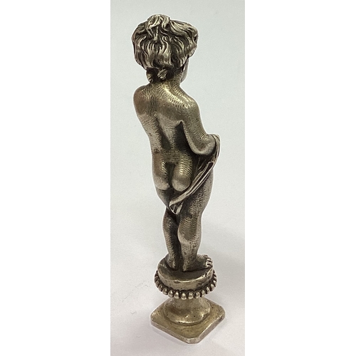 2 - A heavy cast silver figure of a child in standing position. Apparently unmarked. Approx. 79 grams. E... 