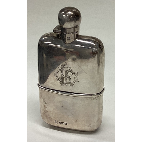 205 - A good quality silver hip flask with detachable base to hinged lid. London. By SM&Co. Approx. 142 gr... 