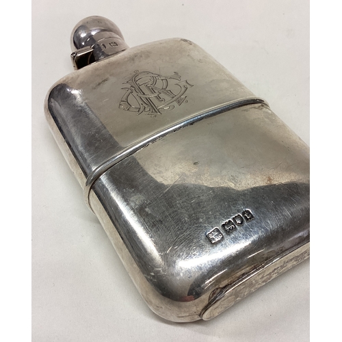 205 - A good quality silver hip flask with detachable base to hinged lid. London. By SM&Co. Approx. 142 gr... 