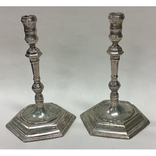 206 - A good pair of Georgian style silver tapersticks of shaped form. Sheffield. By TB&S. Approx. 292 gra... 