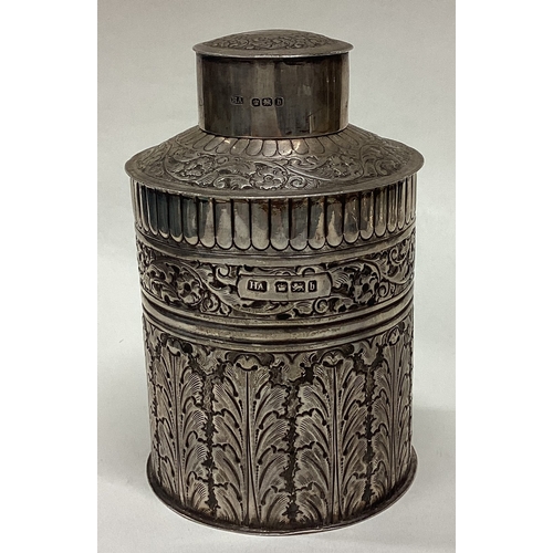 209 - An unusual chased silver tea caddy of cylindrical form. Sheffield. By HA. Approx. 161 grams. Est. £1... 