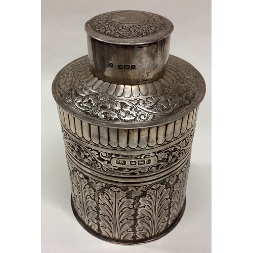 209 - An unusual chased silver tea caddy of cylindrical form. Sheffield. By HA. Approx. 161 grams. Est. £1... 