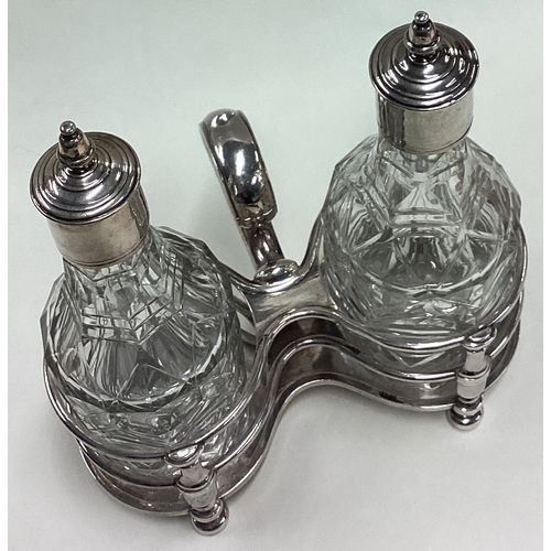 211 - An early 18th Century Queen Anne silver oil and vinegar cruet. London 1709. By Simon Patin. Approx. ... 