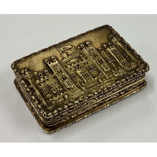 223 - A 19th Century William IV silver gilt castle top vinaigrette depicting Windsor Castle. Birmingham 18... 