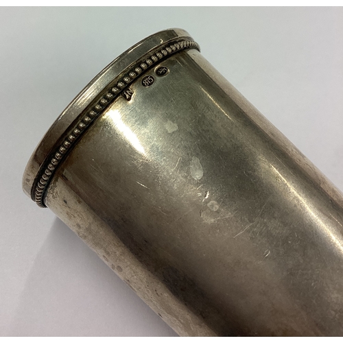 238 - A Russian silver vodka tot engraved with castle scene. Marked 875. Approx. 19 grams. Est. £30 - £50.