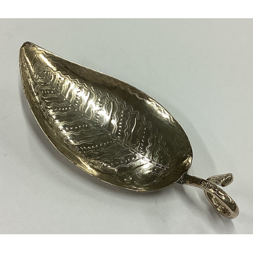 246 - A George III silver bright-cut leaf shaped caddy spoon. London 1809. By Edward Mayfield. Approx. 10 ... 