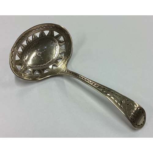 262 - An 18th Century George III bright-cut silver caddy spoon with pierced decoration. London 1794. By GN... 