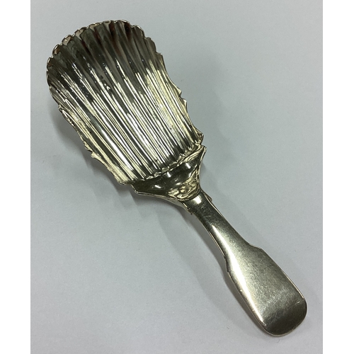 263 - DUBLIN: A rare George III Irish silver fluted caddy spoon. 1815. By Matthew West. Approx. 9 grams. E... 