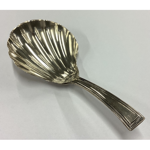 264 - An 18th Century George III silver fluted caddy spoon. London 1799. By Fuller White. Approx. 8 grams.... 