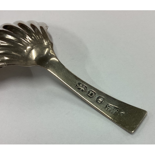 264 - An 18th Century George III silver fluted caddy spoon. London 1799. By Fuller White. Approx. 8 grams.... 