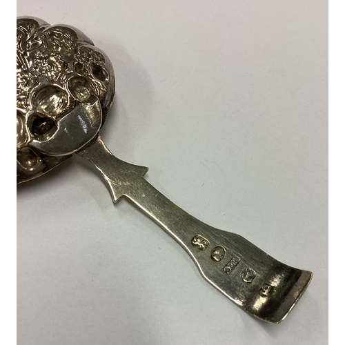 265 - A George III chased silver caddy spoon. Birmingham 1814. By Ledsam & Vale. Approx. 8 grams. Est. £60... 