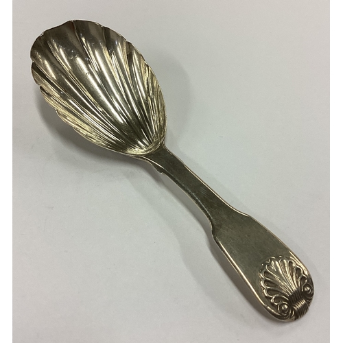 268 - An 18th Century George III fluted silver caddy spoon. London 1794. Approx. 14 grams. Est. £50 - £80.